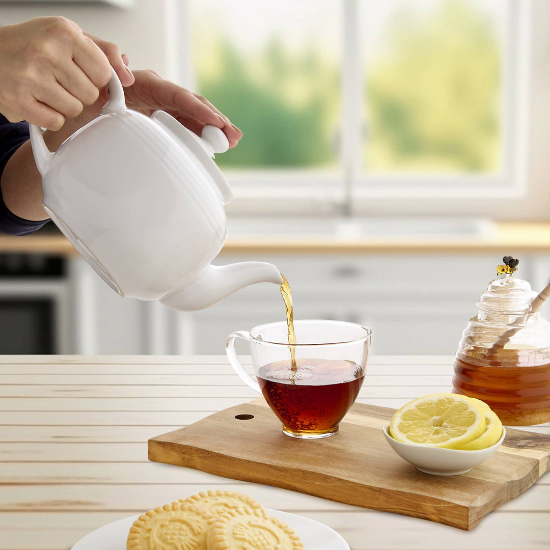 white teapot with strainer for lose tea