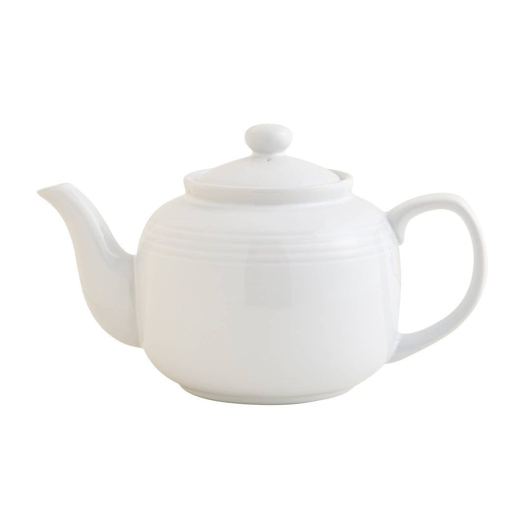white teapot with strainer